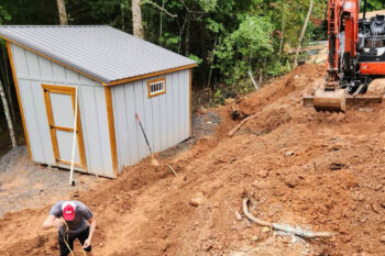 Seamless shed installation with specialized site preparation for sheds, enhancing the durability of your outdoor storage solutions.